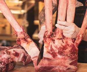 huge steaks being cut